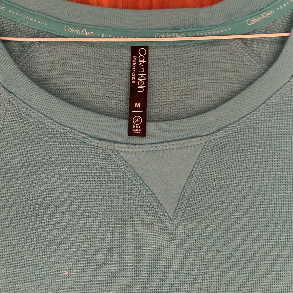 Calvin Klein shirttail hem three quarter sleeve top